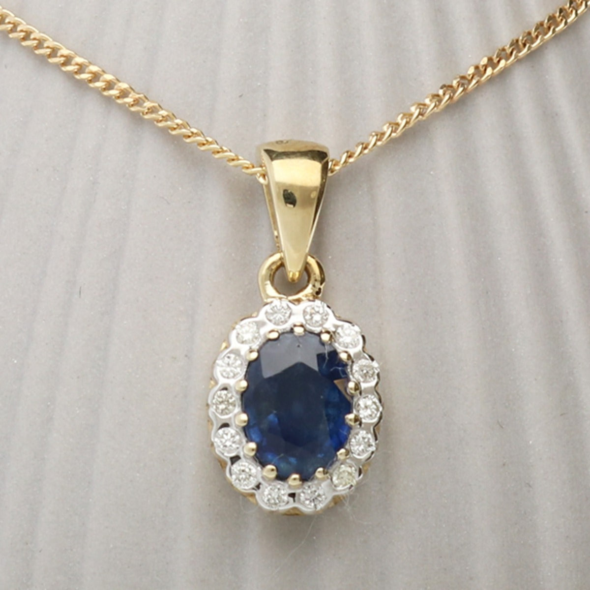 9ct Yellow Gold & Diamond Cluster Set Oval Sapphire Pendant With Optional Chain