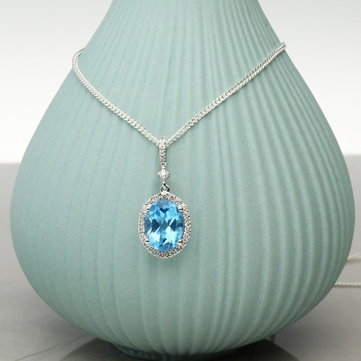 Oval Blue Topaz Pendant Set In 9ct White Gold & Diamonds With Optional Chain - Love Silver Jewellery