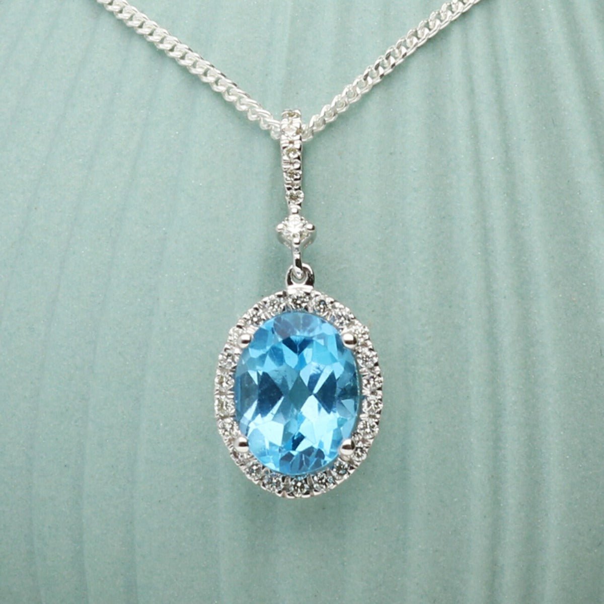 Oval Blue Topaz Pendant Set In 9ct White Gold & Diamonds With Optional Chain - Love Silver Jewellery