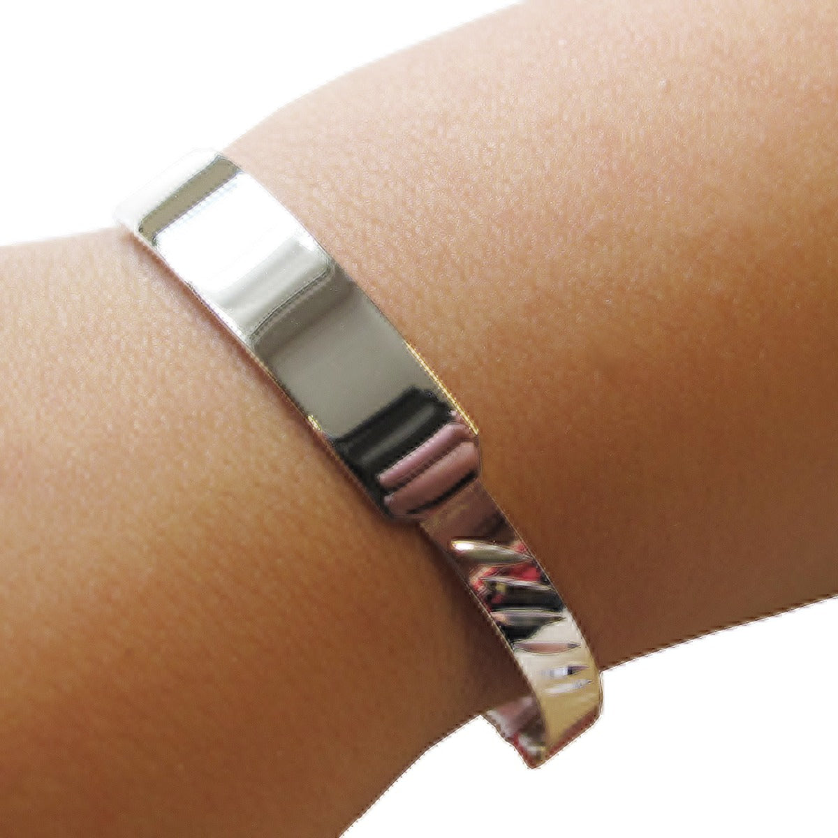 Sterling Silver Engraved Baby and Small Child Expandable ID Bangle on arm.